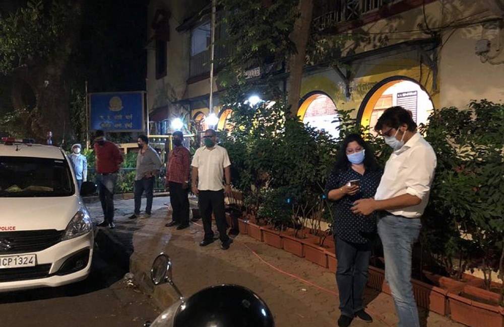 Arnab Goswami with wife standing outside police station after the alleged attack on 23 April 2020